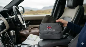 A photorealistic 4K illustration of the lower back massager belt neatly folded and secured inside a protective grey travel case with an embroidered UK flag, positioned in the interior of a UK vehicle, ready for transport.
