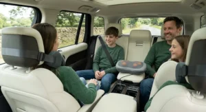 Driver enjoying a comfortable, relaxed posture using a car travel massage pillow during a scenic UK countryside road trip.
