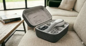 A compact travel case containing the handheld back massager and accessories, ideal for portability.