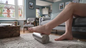 Frozen stainless steel roller reducing acute inflammation and foot arch pain.