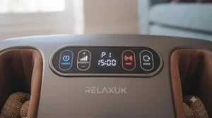 Person relaxing on a sofa while using a shiatsu foot massager at home.