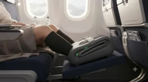 Close-up of a lightweight electric foot massager designed to relieve swollen ankles and circulation issues during long-haul flights.