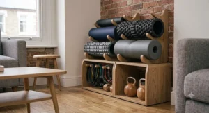 High density foam roller stored neatly alongside a yoga mat and kettlebells in a UK home gym.